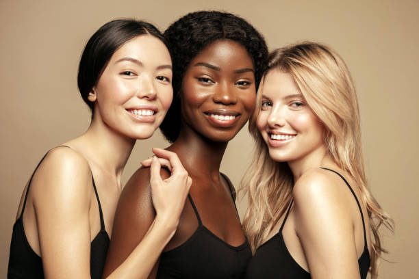 3 females of different races with glowing skin